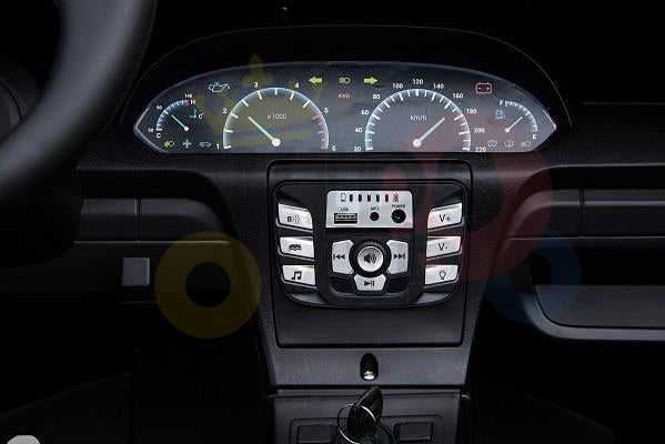 Close-up of the Metallic Blue 24V XXL SuperSport Big Kids Ride On Car dashboard showing a speedometer, tachometer, and fuel gauge. Below is a sleek console with buttons and a CD player. The eco leather-wrapped steering wheel is partially visible on the left.