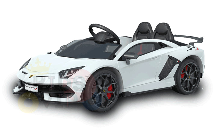 The White 12V Lamborghini SVJ Sport Kids Ride-On Car features black accents, a detailed steering wheel, red brake calipers on rubber wheels, and is equipped with remote control. It offers one black seat for children and operates as a licensed toy sports car.