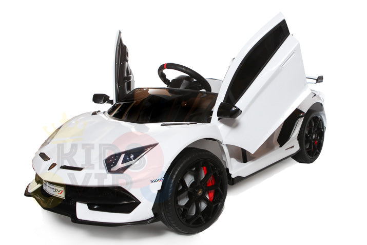 A white 12V Lamborghini SVJ Sport kids licensed ride-on car features upward-opening doors, red-accented rubber wheels, sleek lines, and a sporty design. Perfect as a remote control car for adventurous kids.