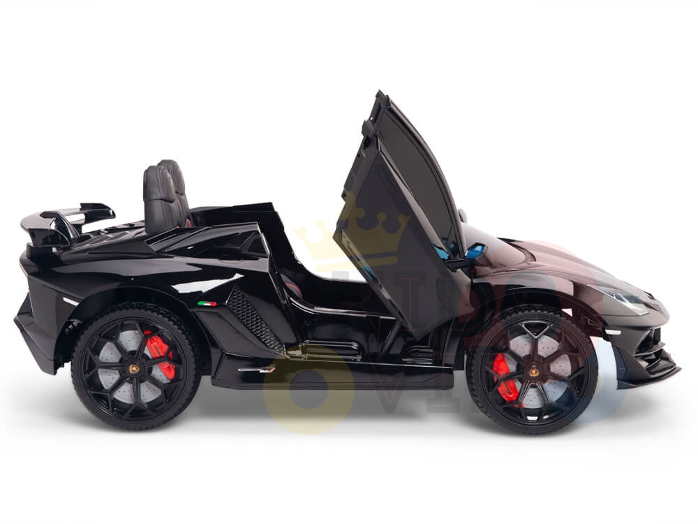 On a white backdrop, the sleek Black 12V Lamborghini SVJ Sport ride-on car for kids showcases its drivers side door open, revealing a one-seater interior. It features red brake calipers and shiny black rims. Complete with rubber wheels and a remote control for extra enjoyment.