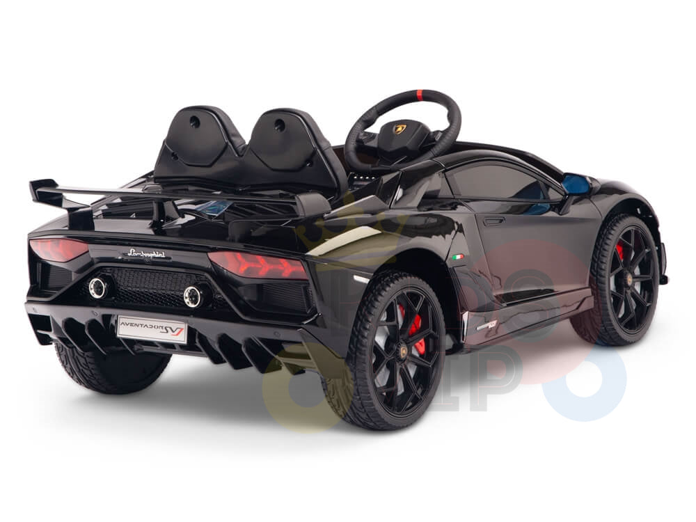 The Black 12V Lamborghini SVJ Sport is a licensed kids ride-on car with one seat, rubber wheels, headlights, and intricate sports car design. Featuring a steering wheel and visible branding on the back, its perfect for young drivers. Includes remote control for adult supervision.