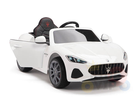 The White 12V Official Upgraded Maserati Gran Cabrio Kids Ride-On Car features an open side door, black seat with red stitching, and realistic detailing like a grille, headlights, and wheels – a luxury sports car-inspired convertible perfect for kids.