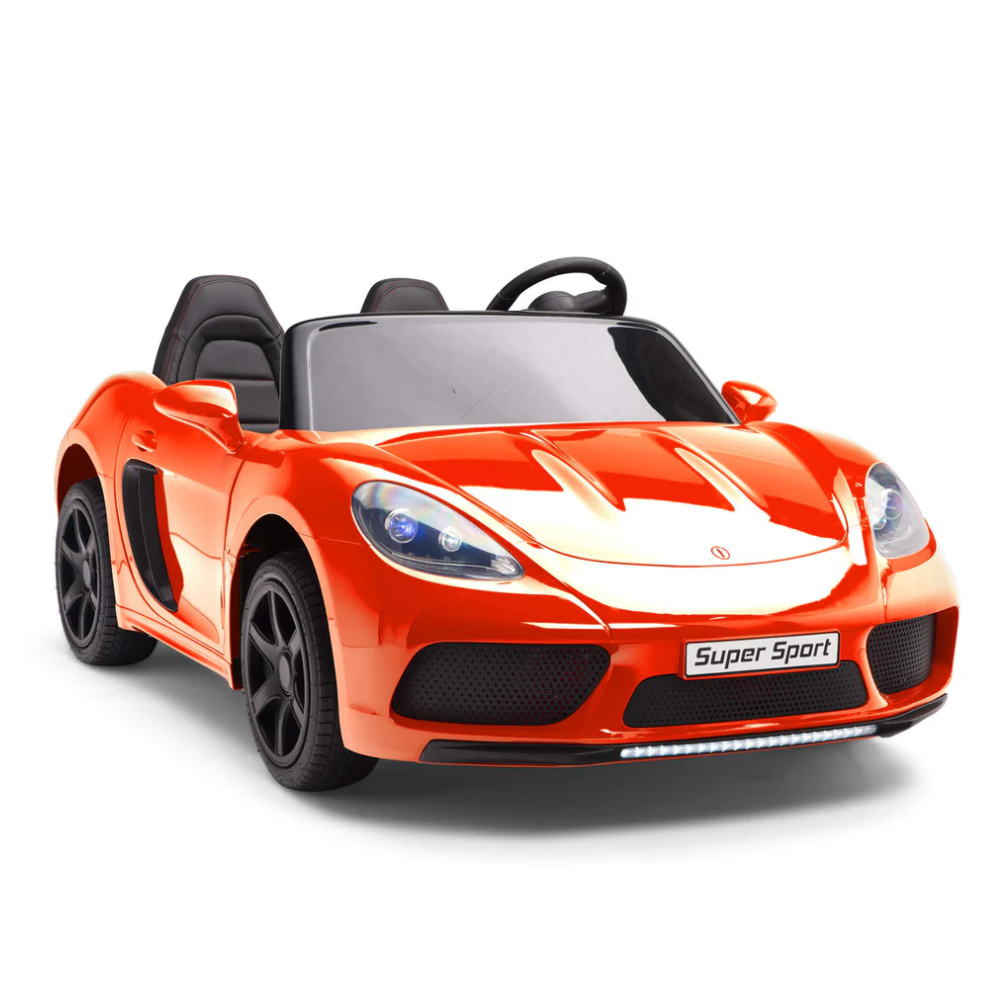 A bright red toy sports car with black seats and a sleek design. It has black wheels, side mirrors, and a steering wheel, with Super Sport printed on the front bumper.