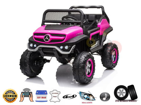 The Pink 12V/4X4 Official Mercedes Unimog Junior Ride On UTV is a pink and black off-road vehicle with large tires, a mesh grille, and metal accents. It features a leather seat, real lights, music capabilities, and can be guided via remote control.
