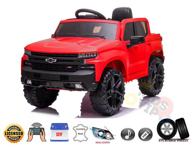 Enjoy an adventure with the Red Official Chevrolet Silverado Truck 12V Kids Ride-on Car. It features black accents, large EVA rubber wheels, a steering wheel, adjustable leather seat, realistic lights, a USB/MP3 player, and includes a remote control for extra fun.