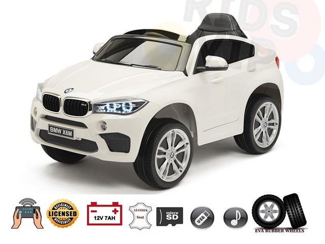 The Limited Licensed BMW X6M 12V Kids Ride On Car features EVA rubber wheels, a performance-focused design, license plate, leather seat, micro SD slot, and parental remote control for peace of mind.