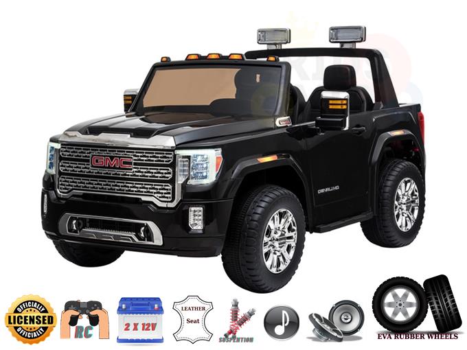 The Black 2x12V Licensed 4WD GMC Sierra Kids Ride On Car features silver accents, large wheels, headlights, side mirrors, a parental remote control, leather seat, MP3 player, and a rechargeable battery.