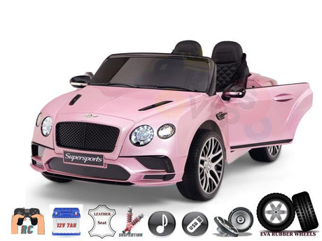 The Pink 12V Bentley GTC Kids Licensed Ride On Car includes open doors, LED headlights, and black details. It features a dashboard with a parental remote control icon, 12V battery, leather seat, suspension, music system, and EVA rubber wheels.