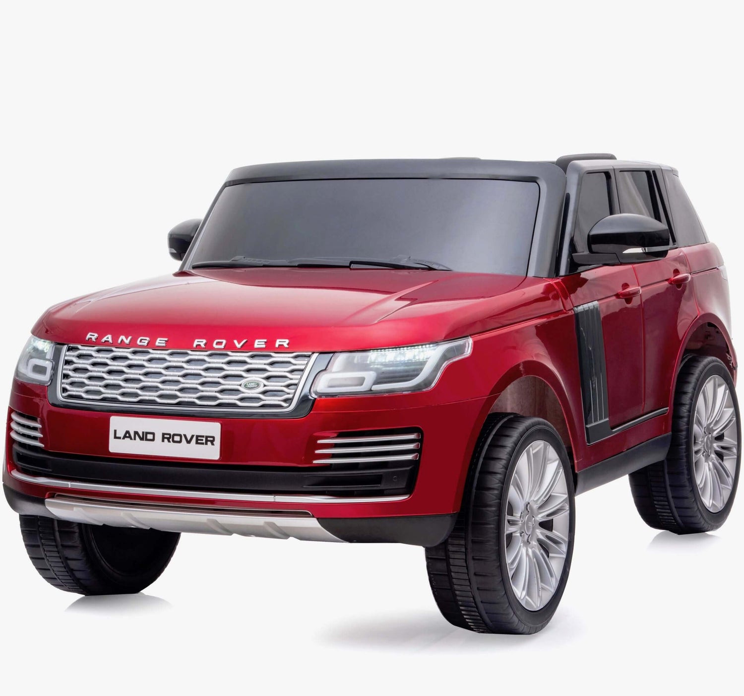 The High-Performance 24v Range Rover HSE toy car features a bright red body, black roof, large smooth tires, and silver details. Prominent front grille and headlights highlight the Land Rover logo on the front license plate, set against a plain white background.