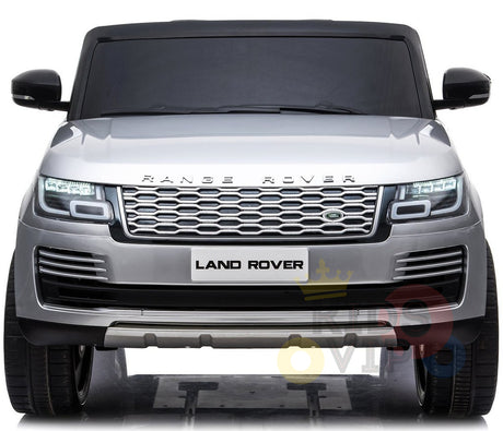 Front view of the 24V Complete Silver Edition 2 Seats Range Rover Kids Ride On Car, highlighting its distinctive grille and LED headlights. The Land Rover brand is on the plate area, offering an exciting ride with a powerful battery on flat surfaces.