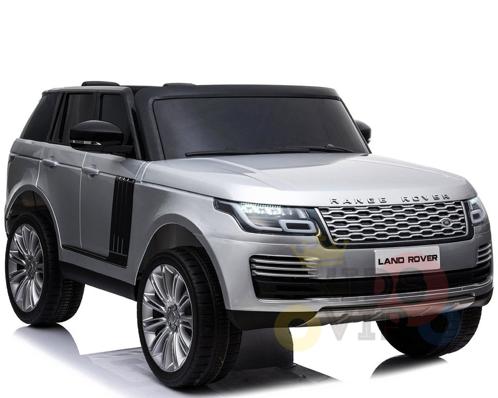 The 24V Complete Silver Edition 2 Seats Range Rover Kids Ride On Car, displayed on a white background, features large wheels, a distinctive front grille, and the iconic Land Rover emblem. Its sleek design is powered by a robust battery and includes RC and MP4 capabilities.