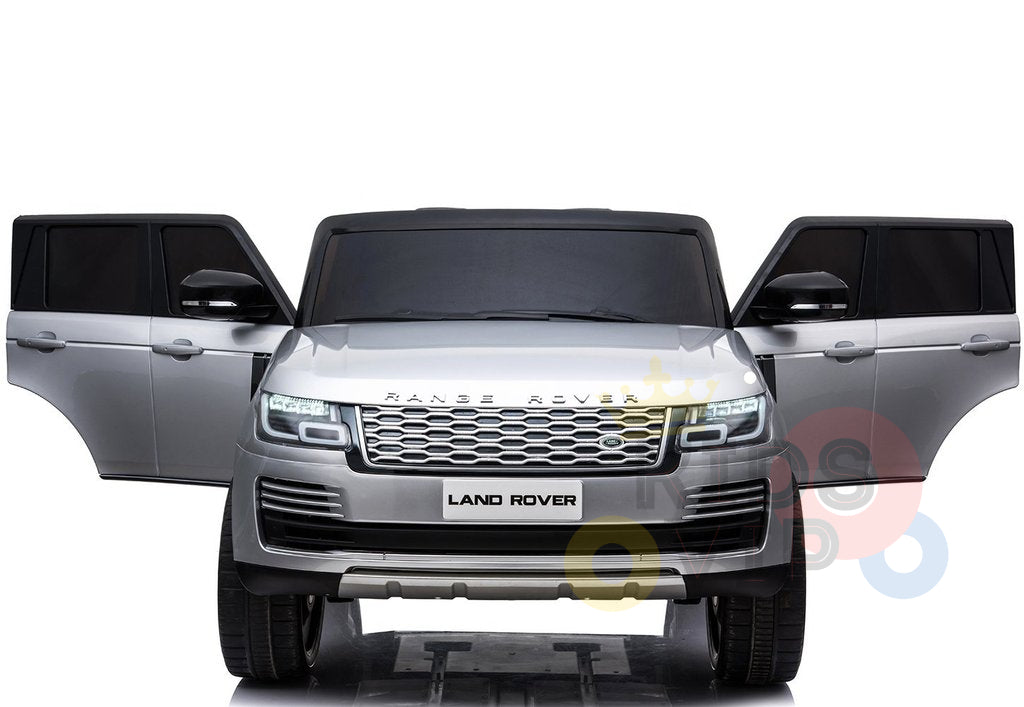 A 24V Complete Silver Edition 2 Seats Range Rover Kids Ride On Car in silver, facing forward with open front doors. The sleek design features a visible grille, headlights, and logo on a white background. It’s the ultimate kids vehicle with RC and MP4 capabilities, merging power and style.