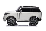 The White 24V Range Rover Ride-On SUV with EVA Wheels & Parental Control, featuring tinted windows and detailed wheels, is elegantly displayed on a reflective surface, adding sophistication to kids playtime adventures.