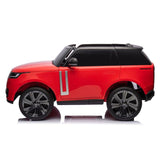 The Red 24V Range Rover Ride-On SUV features large silver rims, a black roof and trims, an eco-leather seat bench, EVA wheels, and parental control. Officially licensed with a sleek modern design, its set against a plain white background.