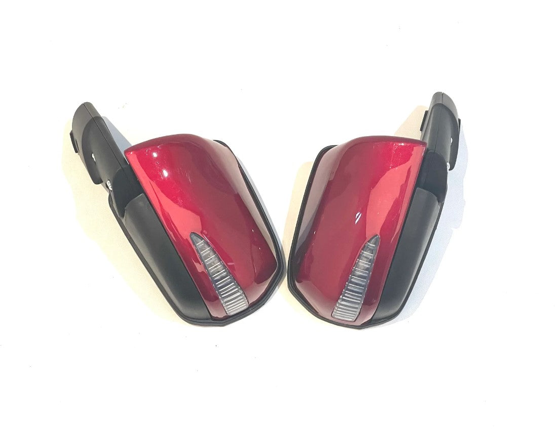 A pair of red and black 12V Lexus side mirrors are displayed against a white background. These mirrors have integrated turn signal indicators, are easy to install, and are perfect as ride-on car accessories.