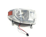 The Passenger Head-Light for 24V Tundra XXL is a clear automotive assembly with LED bulbs, a reflective interior, and red side accents on a white background. It features two wires with a black connector at the bottom, designed to perfectly fit your ride-on car.