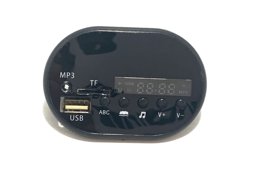 The Radio for 12V/2 Seater Tundra is a compact, black, oval MP3 player featuring a USB port, TF card slot, volume control, and play/pause buttons. An LED display shows frequency and USB mode. Its easy to install, making it perfect for enhancing ride-on car performances.