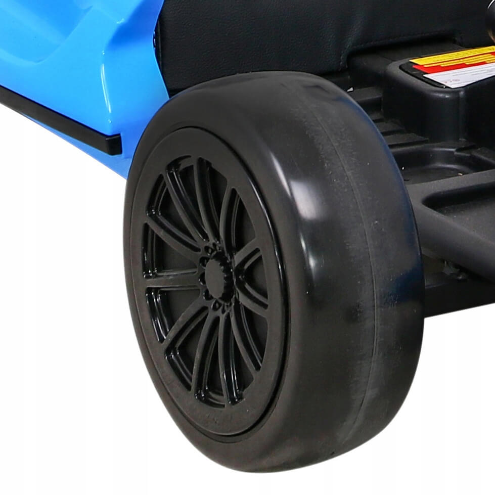 Close-up of a black EVA-rubber wheel with a detailed rim attached to the Blue Big Kids 24 Volt Ultra-Violent Complete Edition Drifting Go-Kart, featuring a sleek design and visible seat component for high-speed drifting action.