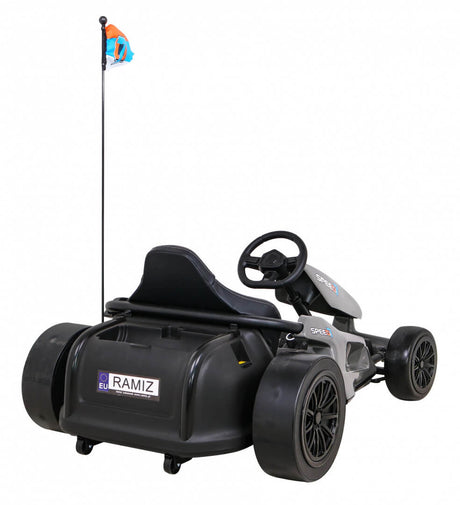 The Grey Big Kids 24V Ultra-Violent Complete Edition Drifting Go-Kart boasts a sleek design with a seat, steering wheel, four wheels, rear spoiler, and vertical flagpole adorned with a blue flag. Featuring Ramiz decals on the back, its perfect for thrilling drifts.