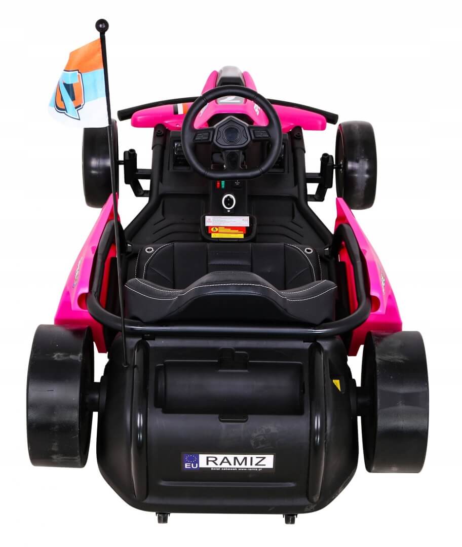 The Pink 24V Ultra-Violent Big Kids Complete Edition Drifting Go-Kart features a steering wheel, seat, black wheels with accents, and a colorful flag. Viewed from above, it promises thrilling high-speed drifting adventures.