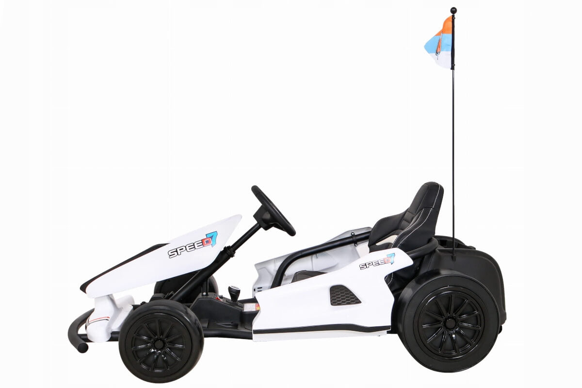 The Big Kids 24 Volt Ultra-Violent Complete Edition Drifting Go-Kart features a sleek white design with black wheels, a Speed 7 logo, and a flagpole with a small blue and orange flag. It offers an ergonomic black seat for comfort.