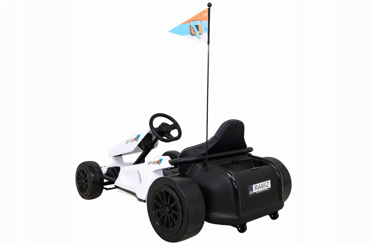 The Big Kids 24 Volt Ultra-Violent Complete Edition Drifting Go-Kart is a white ride-on with black seat and wheels, featuring a steering wheel and a flagpole with a blue-orange flag. The rear has RAMIZ branding, perfect for an exhilarating drifting experience.