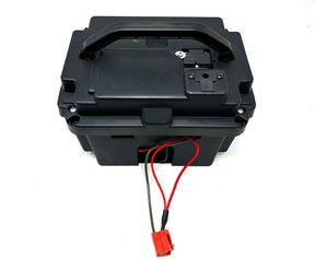 A black 24V battery pack for a Can-am Maverick with visible wiring.