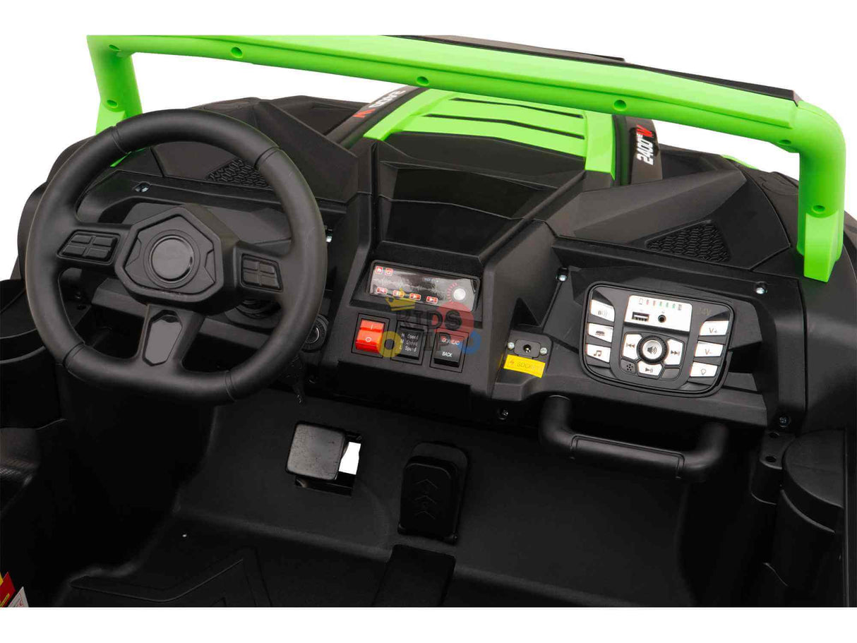 Inside the Green 2 Seater XXL Blade XR Edition 24V 180W Ride On Buggy UTV, theres a steering wheel, digital display dashboard, various buttons, and a foot pedal. Its black frame with green accents features luxurious ECO Leather Seats for added comfort during playtime adventures.