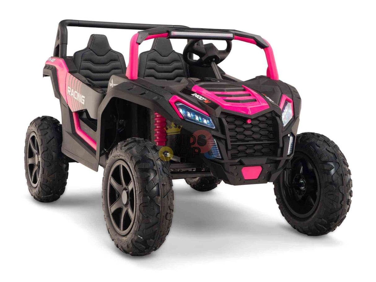 Introducing the Big Kids 24V/180W Blade XR Pink Edition: a toy off-road vehicle with pink, black, real inflatable rubber tires. This buggy boasts large wheels, two seats, LED-style headlights, and Racing on the side—ideal for adventurous young riders!.