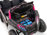 The Big Kids 24V/180W Blade XR Pink Edition Ride on Buggy features an open hood with blue and red wiring, sporty black and pink design, large textured wheels, comfortable black seat, and upgraded inflatable rubber tires for an adventurous experience.