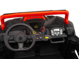 Zoomed-in shot of the Big Kids 24V/180W Blade XR Red Edition Ride On Buggy dashboard, highlighting the steering wheel, control panel with buttons, knobs, and a digital screen. A red bar runs across the top for added style.