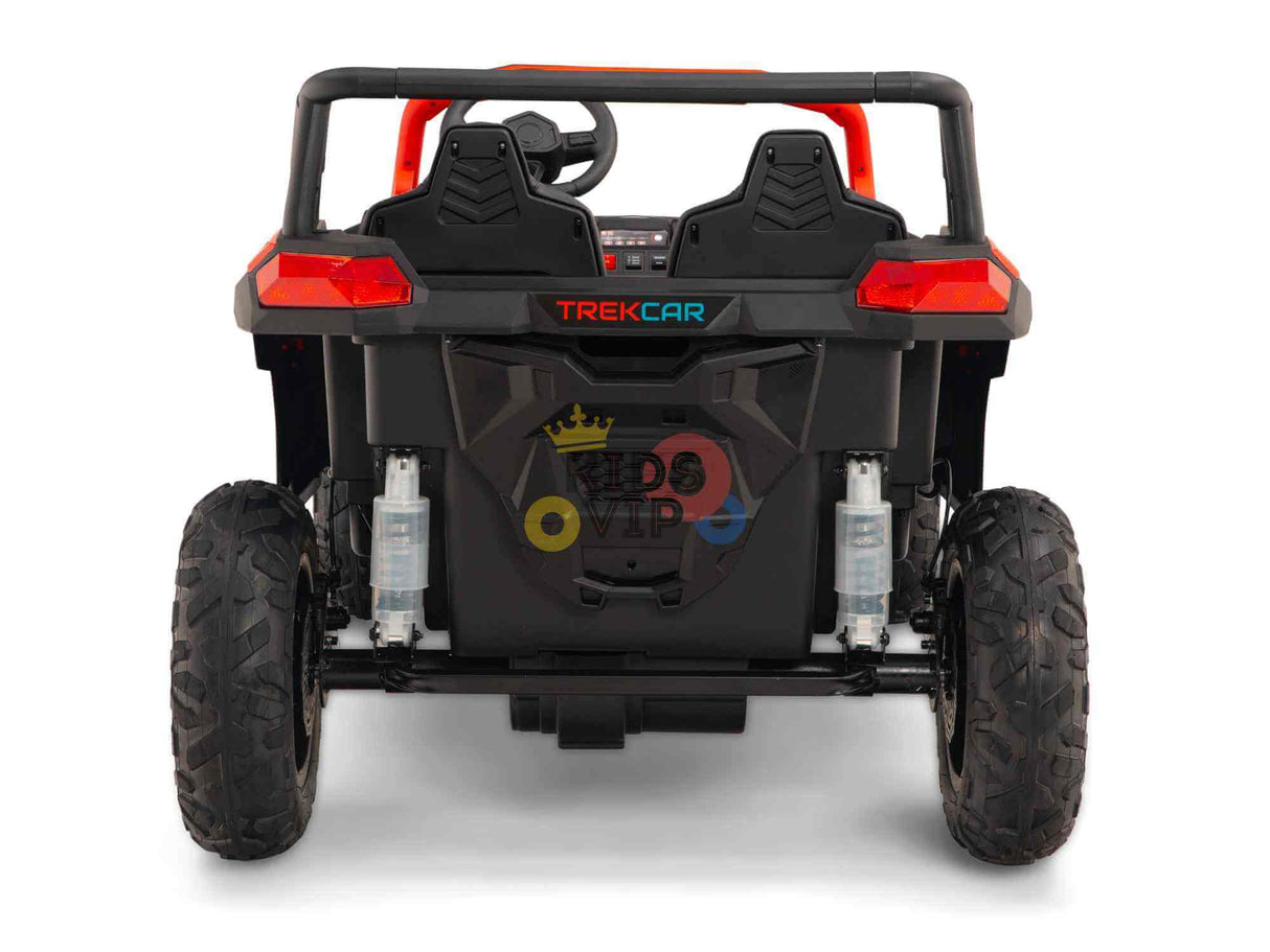 Rear view of a red Big Kids 24V/180W Blade XR Edition ride-on buggy with large rugged wheels and visible steering wheel. The car, branded TREKCAR, features ECO Leather Seats for added comfort.