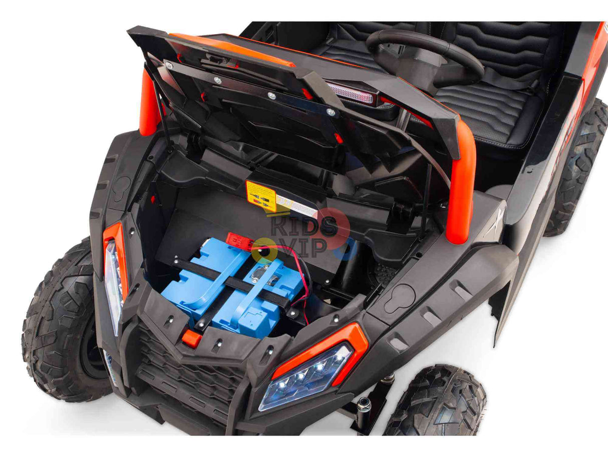 The Big Kids 24V/180W Blade XR Red Edition Ride-on Buggy is designed for adventure, boasting a robust style with black and orange details, large textured wheels, and eco leather seats. The hood reveals the battery compartment, offering an exciting ride for young explorers.