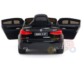 A rear view of the Black Licensed BMW GT 12V Kids Ride On Power Car with doors open highlights its realistic details and BMW 6 GT license plate on a white background, showcasing its upgraded features.