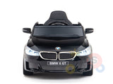 A small, black BMW GT toy car is shown from the front, featuring an upgraded detailed grille and headlights with a single seat. This official electric kids ride-on proudly displays the BMW 6 GT label and is named the Black Licensed BMW GT 12V Kids Ride On Power Car with Remote Control.
