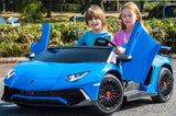 Two children are in a Blue Giant Official Limited Edition Lamborghini SV 24V/180W ride-on car, featuring gull-wing doors and plush eco-leather seats. The child on the right grips the wheel with trees and parked cars in the background.