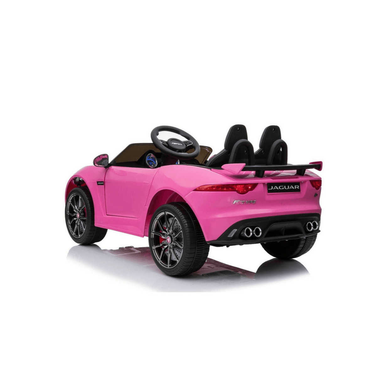 The Official 12V Jaguar F-Type Complete Edition Kids Ride-On Car includes a pink design, two black seats, detailed wheels, steering wheel, realistic rear with exhaust pipes, and a parental remote. Positioned facing right on a reflective surface for added visual appeal.