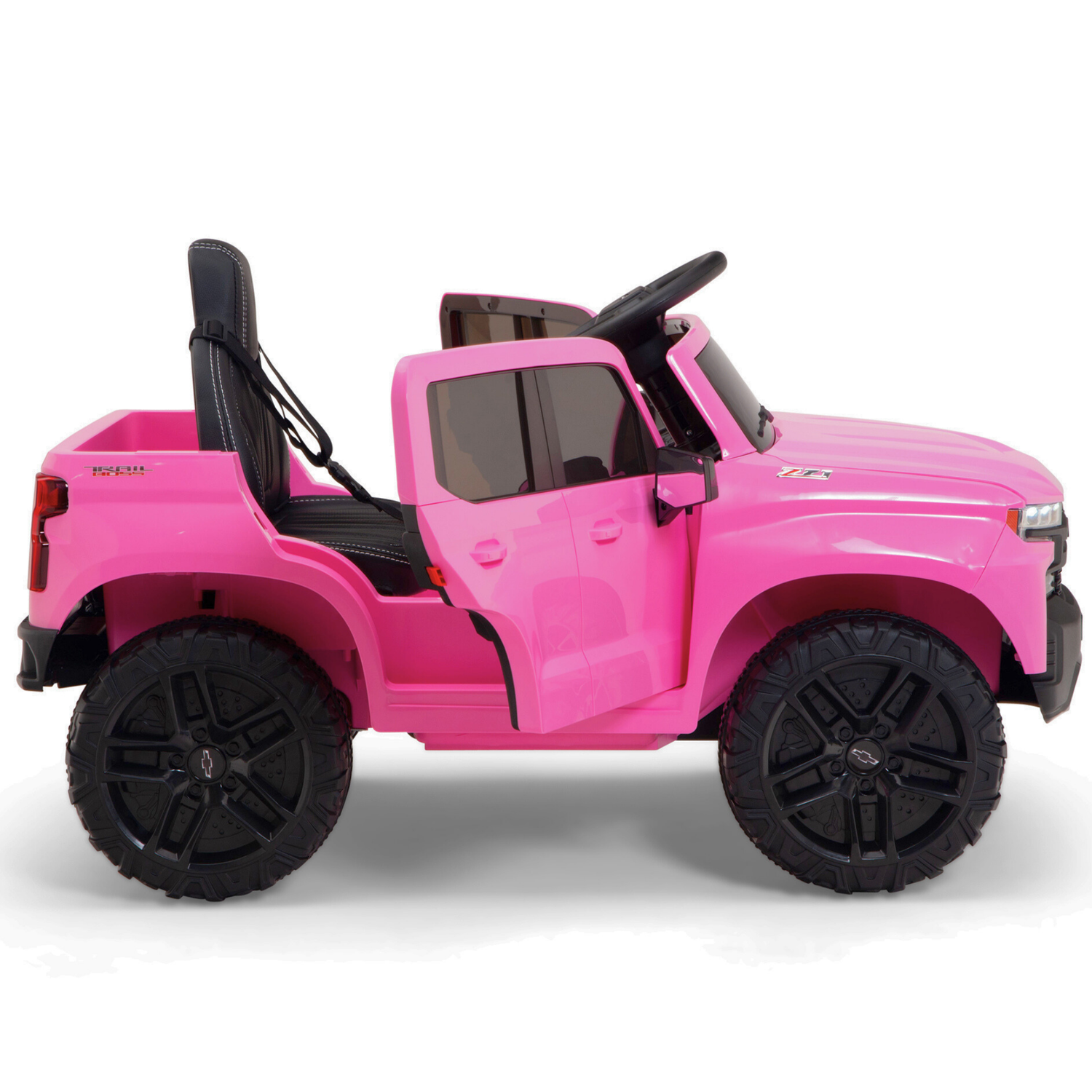The Pink 12V Chevrolet Silverado Kids Licensed 1 Seater Ride On Truck features music, a remote, black seats, and oversized tires. With an open door showcasing the sleek interior, this toy stands proudly in profile view.
