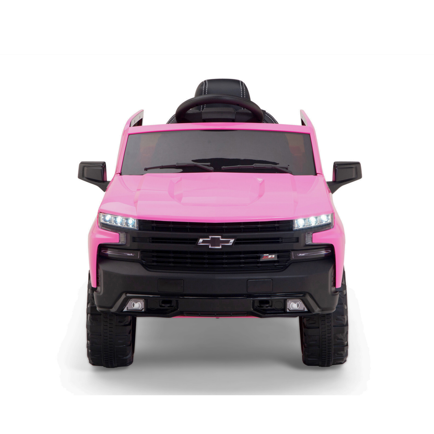 The Pink 12V Chevrolet Silverado Kids Licensed 1 Seater Ride On Truck is front-view photographed, boasting LED headlights, a sturdy bumper, and a black steering wheel. It includes remote control for fun and safety.