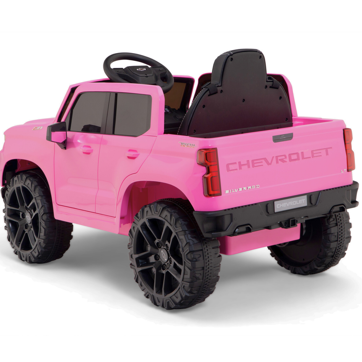 The Pink 12V Chevrolet Silverado Kids Licensed 1 Seater Ride On Truck features black wheels, a seat, and realistic details like a steering wheel and tailgate, with Chevrolet displayed on the back for authenticity.