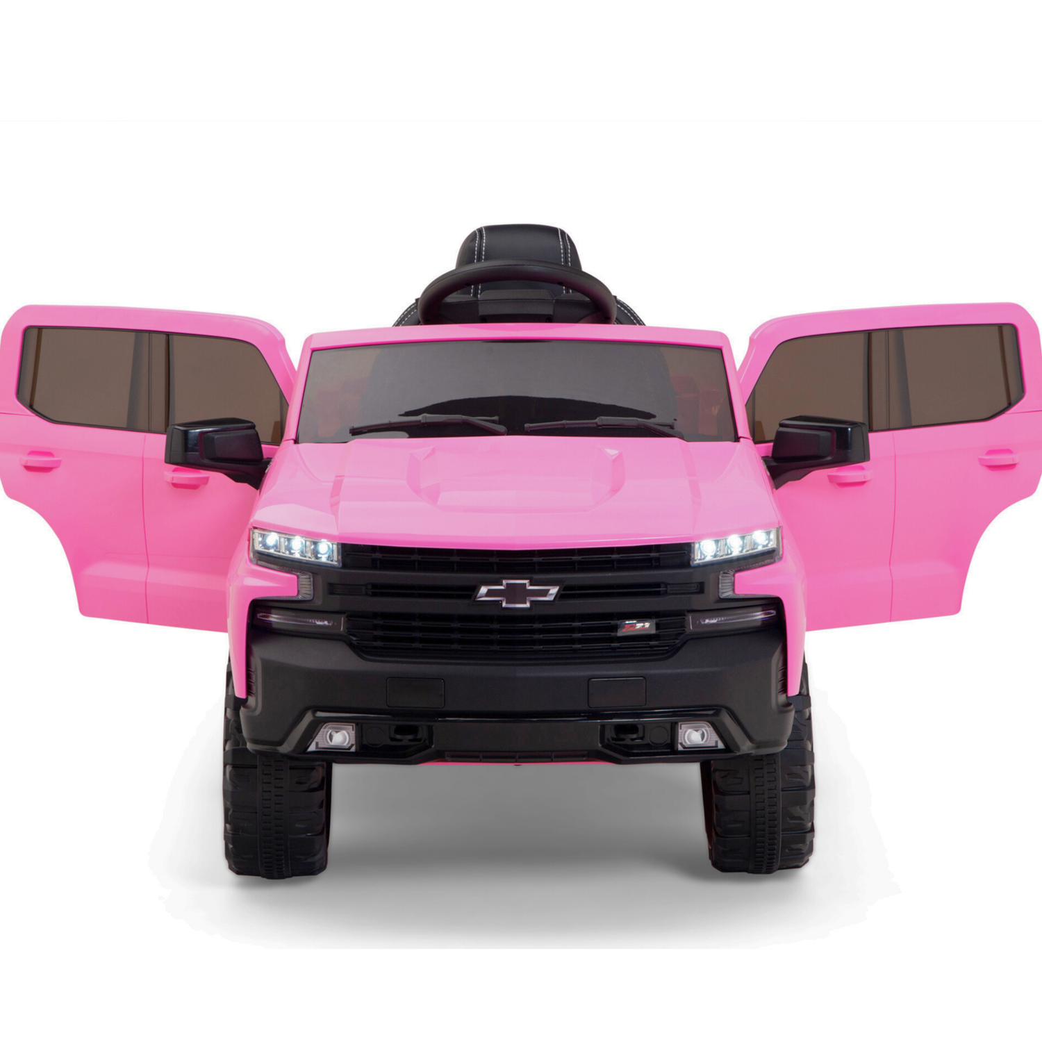 The Pink 12V Chevrolet Silverado Kids Licensed 1 Seater Ride On Truck resembles a real Chevy, featuring black details, open doors with a black steering wheel, chunky black wheels, small headlights, and remote control functionality for enhanced fun.