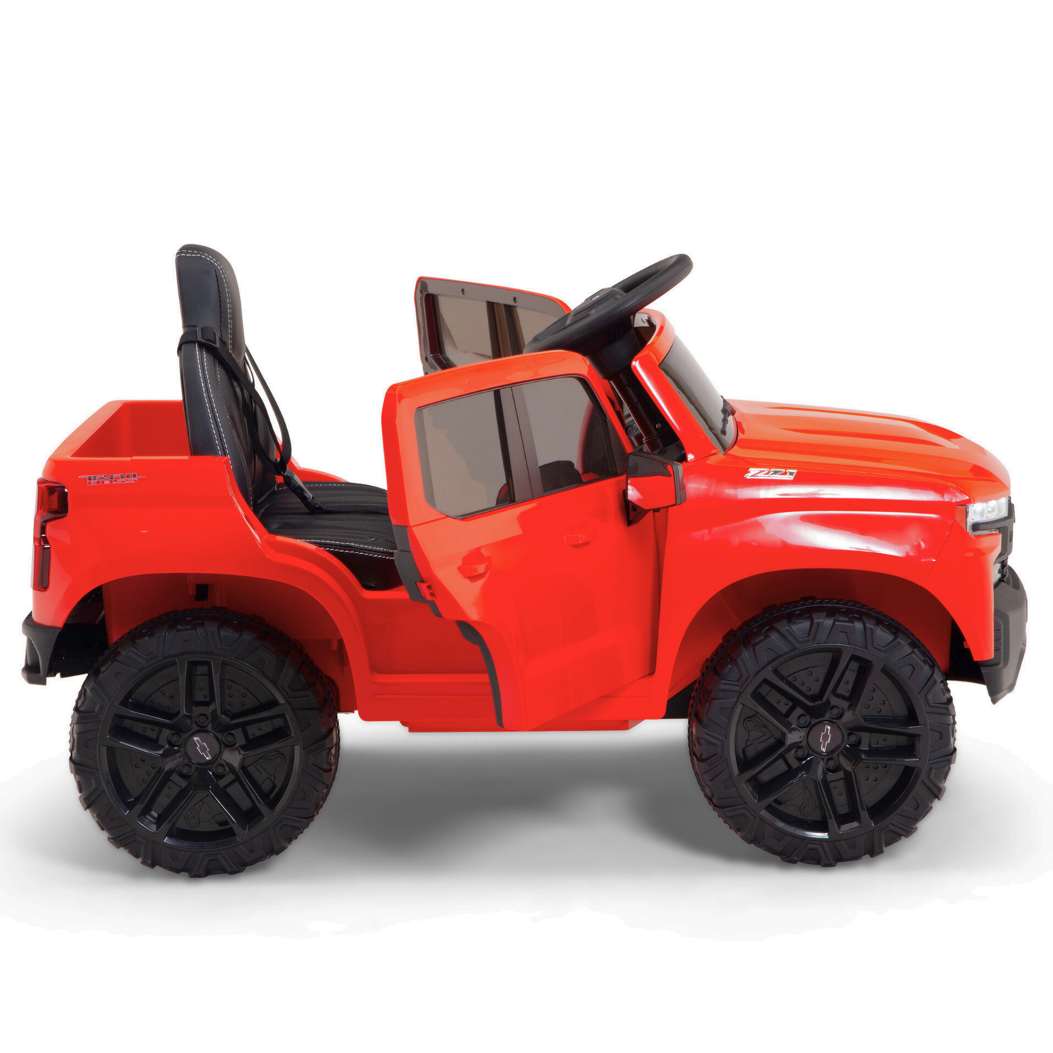The Red 12V Chevrolet Silverado Kids Licensed Ride-On Truck features large black wheels, an open, doorless design, a black seat and steering wheel. Perfect for adventurous kids craving thrilling outdoor experiences.