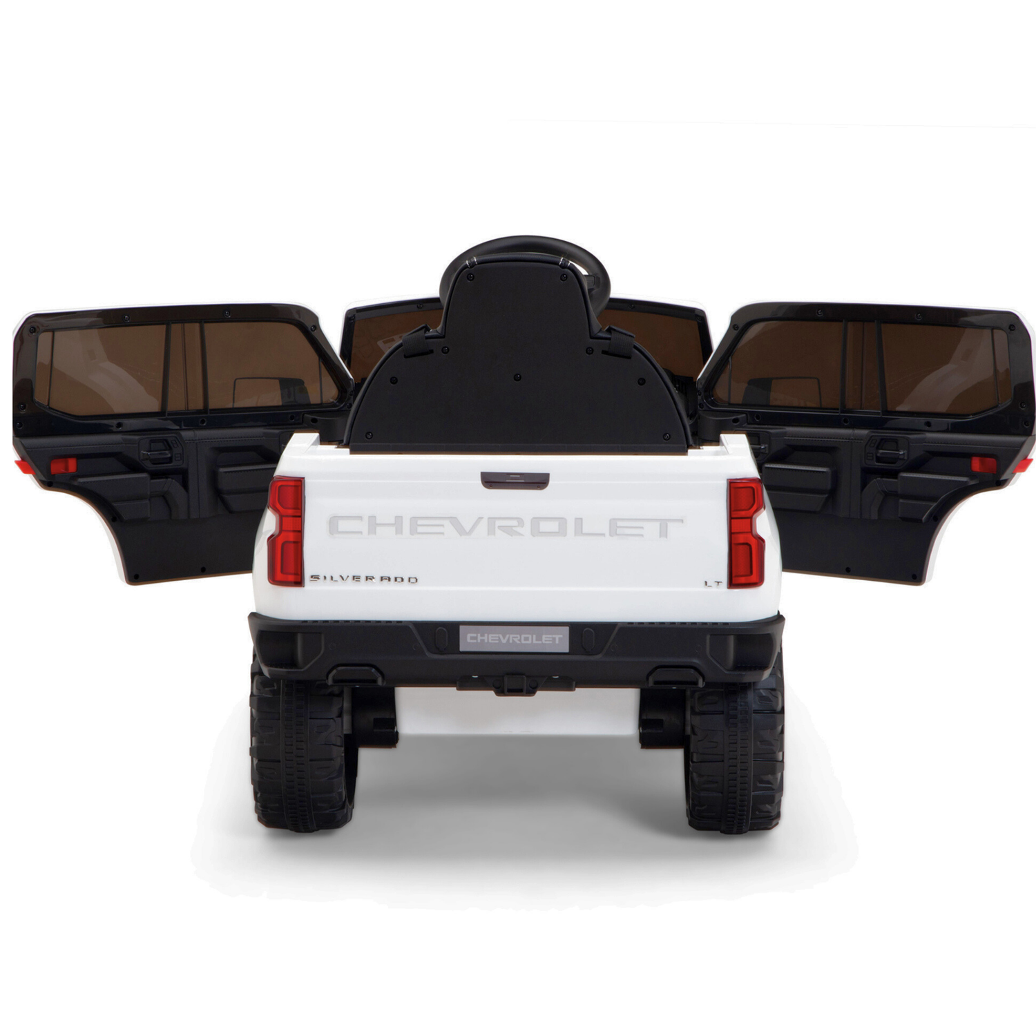 The White 12V Chevrolet Silverado Kids Licensed 1 Seater Ride On Truck features open doors and a tailgate modeled after the real vehicle, large black wheels, detailed branding, music capabilities, a remote control for parental assistance, and upgraded features for an authentic driving experience.