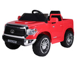 The Red 12V Licensed Upgraded Toyota Tundra 1 Seater Kids Ride On Truck features a black steering wheel, silver accents, large black tires, a shiny front grille, and includes a parental remote control for added safety.