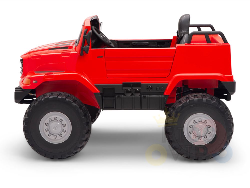 The Red 12V Mercedes Benz Zetros Kids 1 Seater Ride On Truck sports large black rubber wheels and an open-top design, highlighting the interior seating. Positioned in profile on a white background, this vibrant toy off-road vehicle is perfect for children.