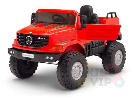 This red ride-on Mercedes-Benz Zetros 12V features large off-road wheels, black seats, a front grille with an emblem, side mirrors, and door handles. It includes a full set of switches for a realistic driving experience.