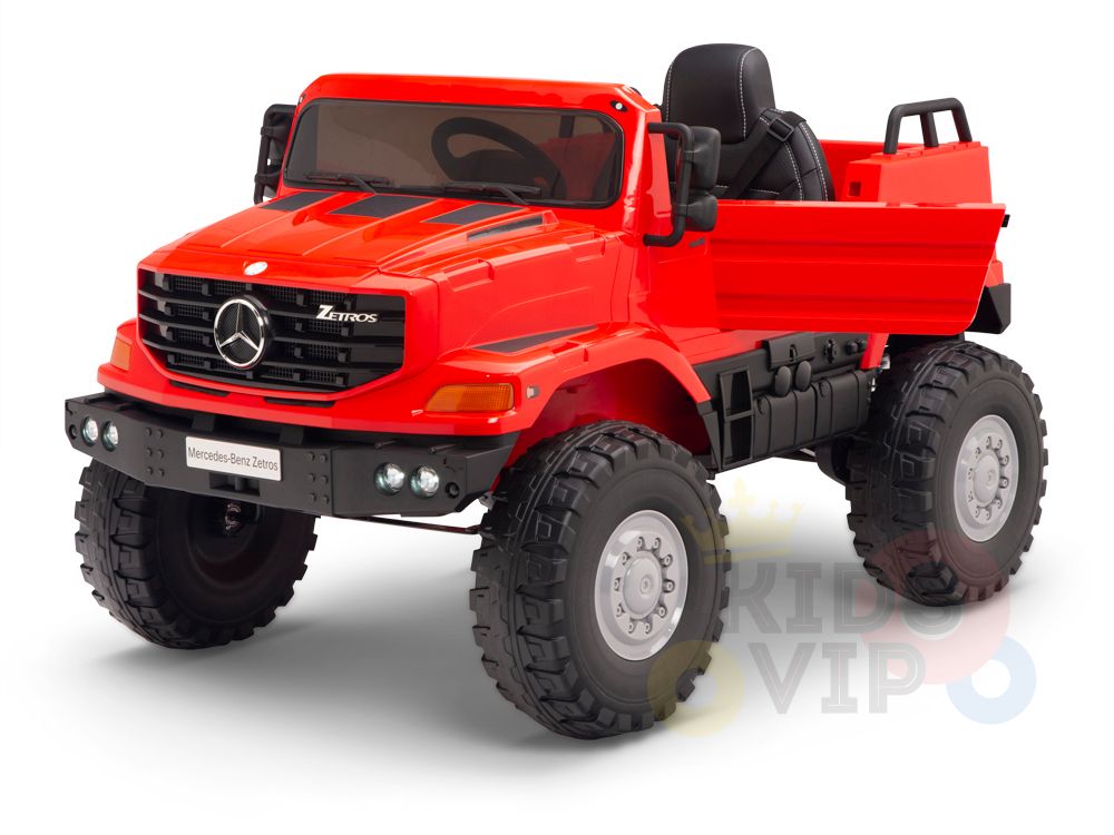 The Red 12V Mercedes Benz Zetros Kids 1 Seater Ride On Truck showcases a detailed grille, large rubber wheels, an open seat, and the iconic logo. It includes a parental remote for safety and is set against a clean white background.