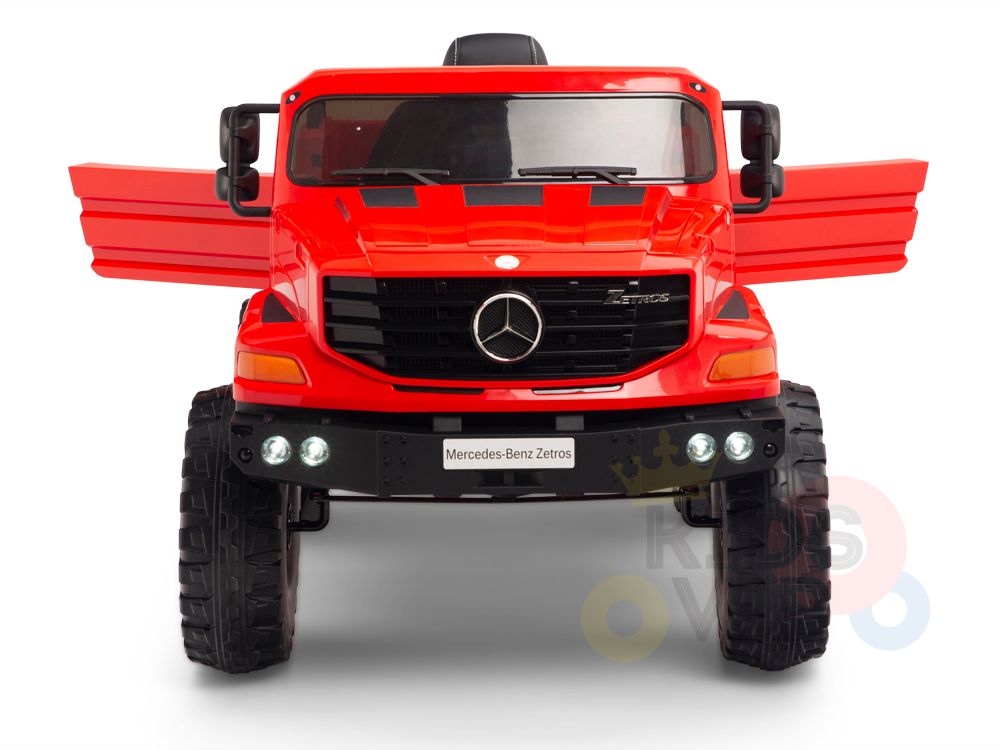A Red 12V Mercedes Benz Zetros Kids 1 Seater Ride On Truck is shown from the front, featuring oversized rubber wheels, a Mercedes emblem on the grille, wide open wing doors, headlights, and a visible bumper. It offers a parental remote control option.