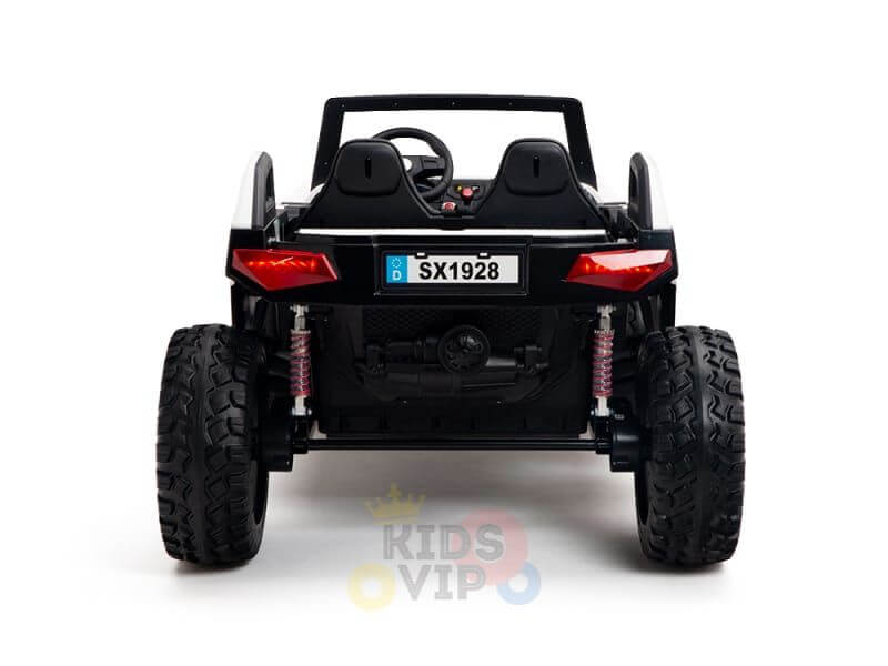 Rear view of a black 24V/4X4 Dune Buggy Ride On UTV with large rubber wheels and red shocks for kids. It features a realistic steering wheel, a drivers seat, the license plate SX1928,” and the faint KIDS VIP logo.