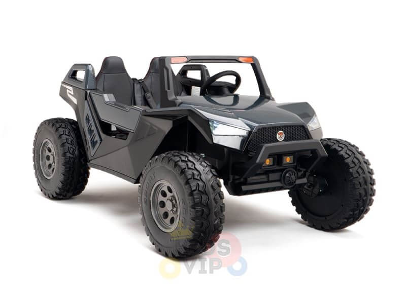 The Black 24V/4X4 Dune Buggy Ride On UTV is a two-seater toy resembling an off-road vehicle, featuring large rubber wheels, a front bumper, and a steering wheel. Its angular lines and sleek design give it a sporty appearance.